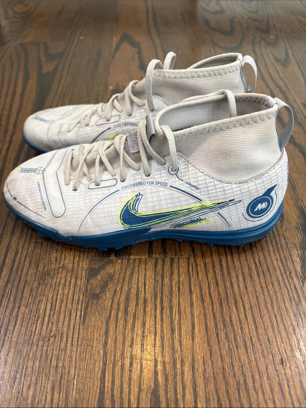 Nike Kids White High-Top Turf Sneakers with Blue and Neon Yellow Accents